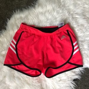 Adidas pink short, black and white stripes.